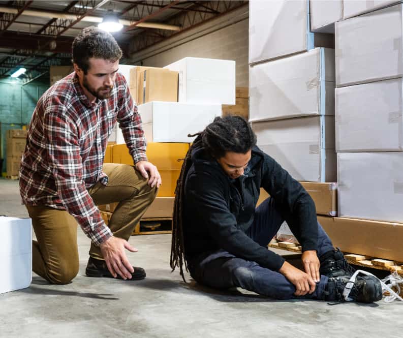 photograph of a worker experiencing a work related injury, who may need a worker's comp attorney