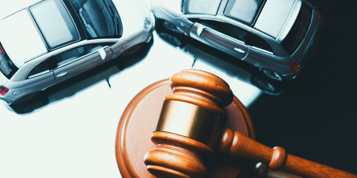 a gavel next to a car accident